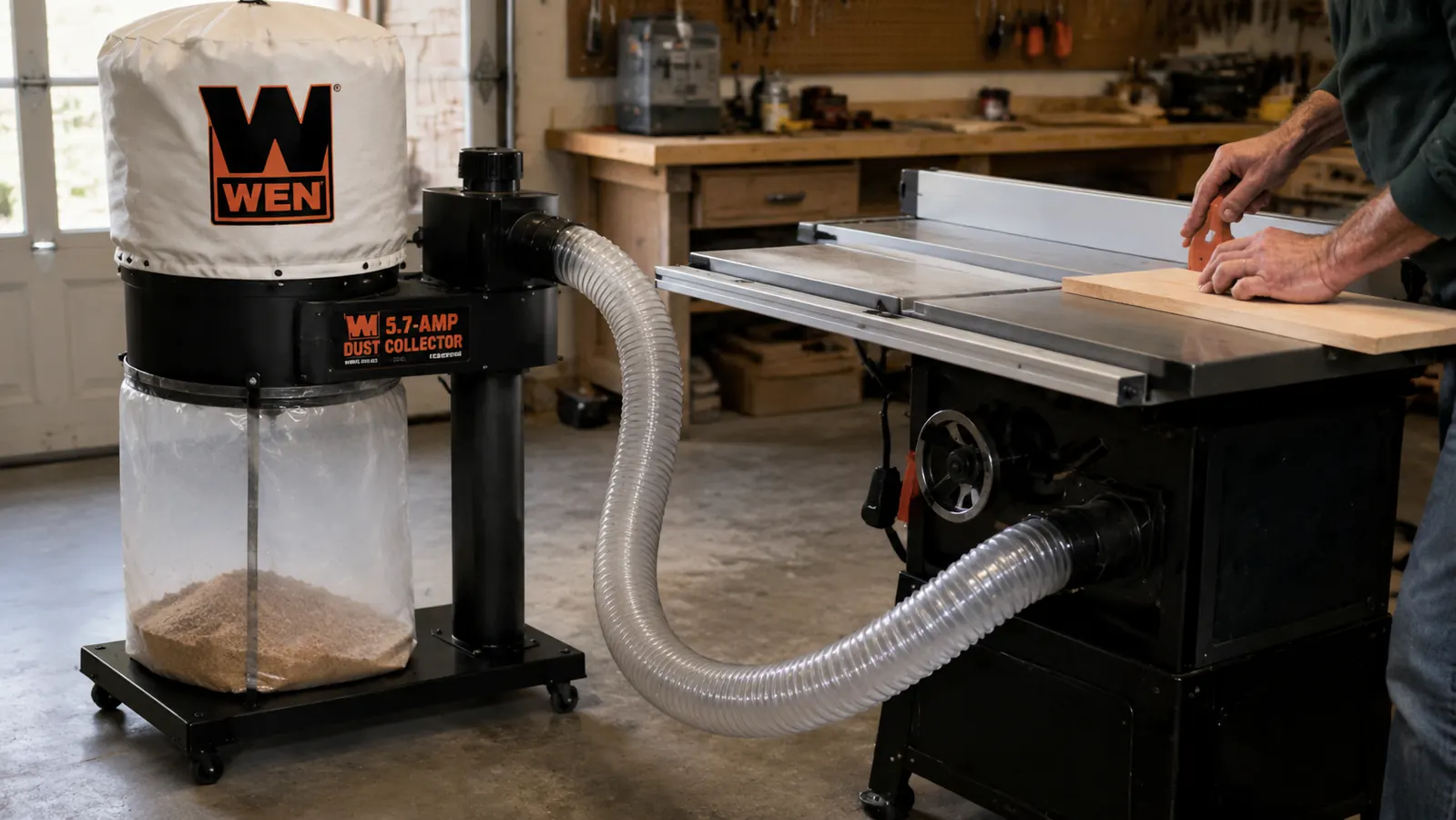 WEN dust collector connected to a table saw via a 4-inch flex hose, mobile base visible beneath the unit