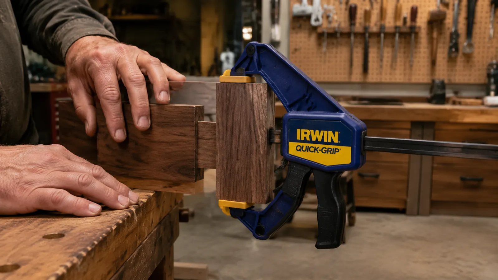 Side view of IRWIN Quick-Grip clamp jaws showing slight racking angle when clamped hard on a mortise-and-tenon joint