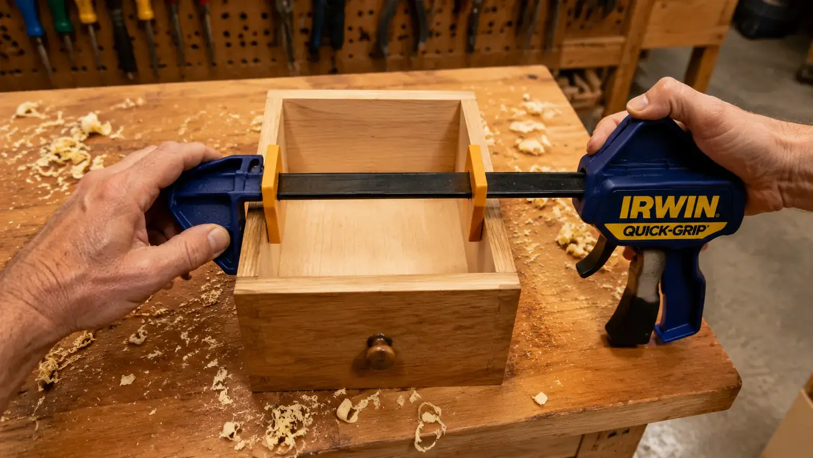 IRWIN Quick-Grip clamp used as a spreader clamp to push apart a drawer carcass joint